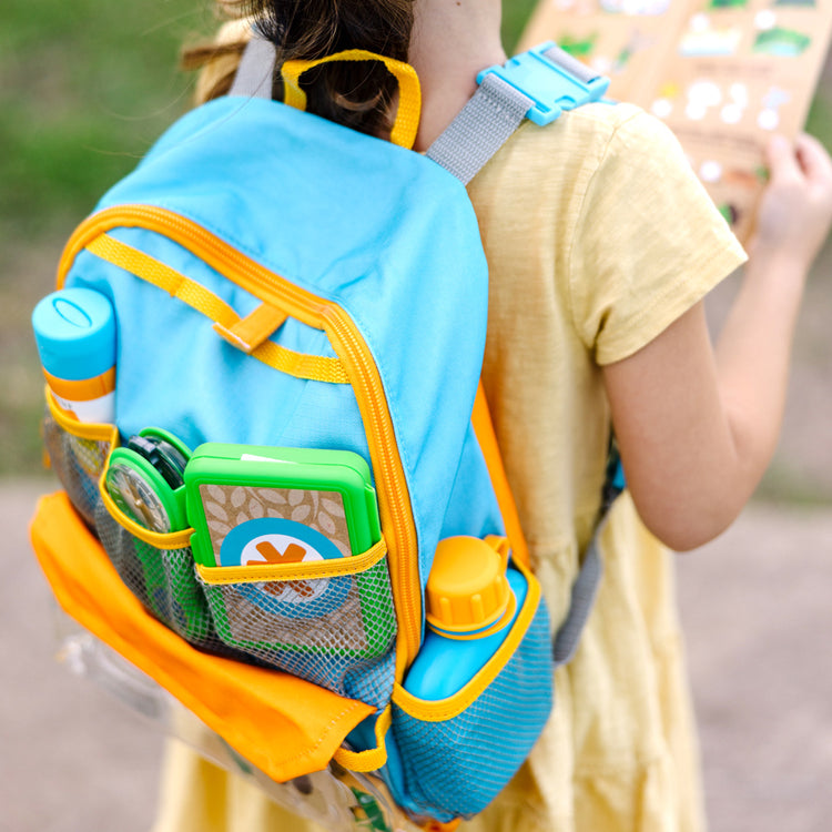 child wearing Let's Explore Backpack