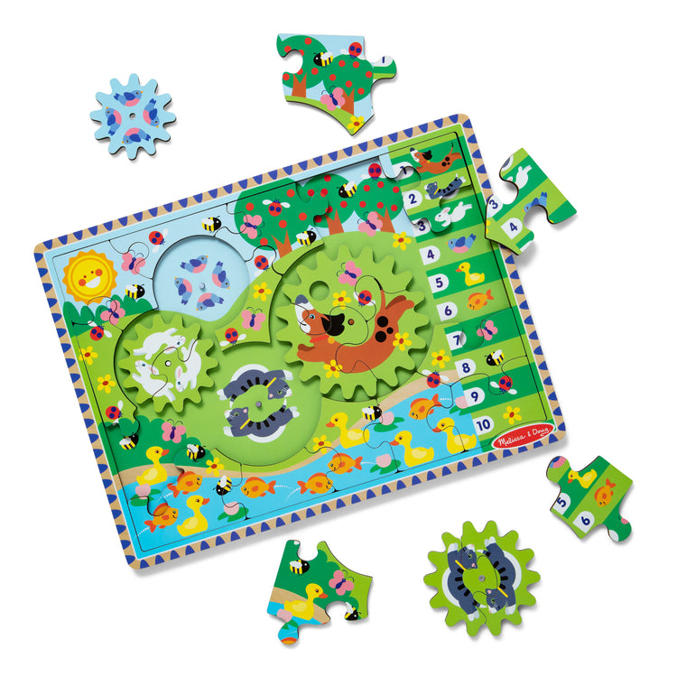 The loose pieces of The Melissa & Doug Wooden Animal Chase Jigsaw Spinning Gear Puzzle – 24 Pieces