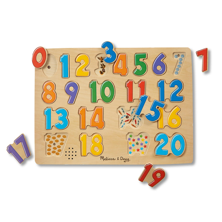 The loose pieces of The Melissa & Doug Numbers Sound Puzzle - Wooden Puzzle With Sound Effects (21 pcs)