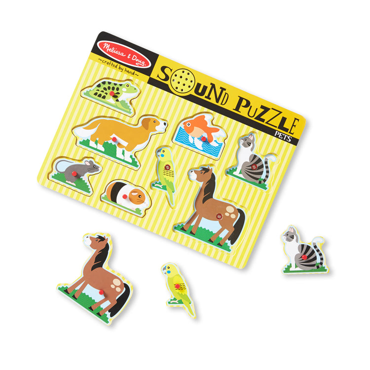 The loose pieces of The Melissa & Doug Pets Sound Puzzle - Wooden Peg Puzzle With Sound Effects (8 pcs)
