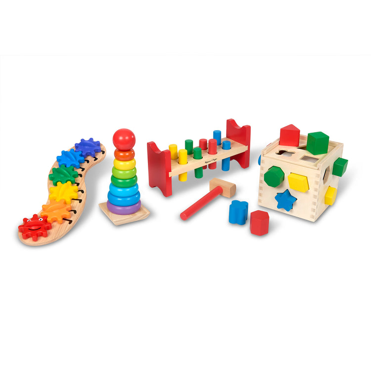 The loose pieces of The Melissa & Doug 4 Wooden Classic Rainbow Learning Toys