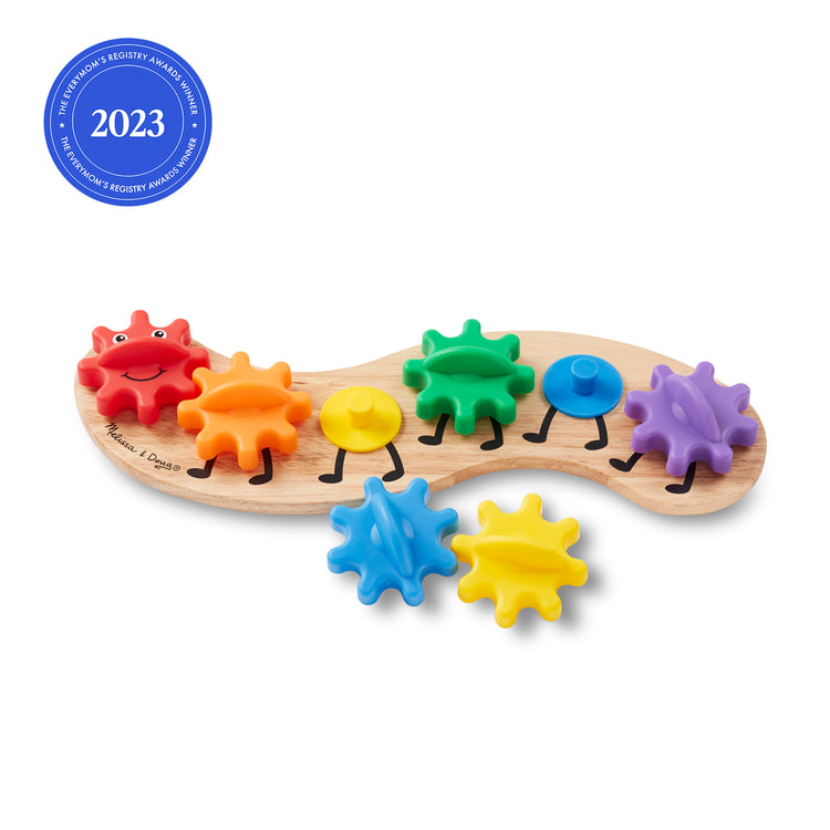 The loose pieces of The Melissa & Doug Wooden Rainbow Caterpillar Gears Toddler Toy With 6 Interchangeable Gears