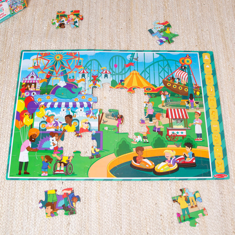 A playroom scene with The Melissa & Doug Fun at the Fair! Cardboard Jigsaw Search & Find Floor Puzzle – 48 Pieces