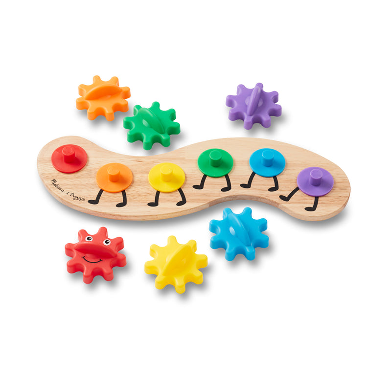 The loose pieces of The Melissa & Doug Wooden Rainbow Caterpillar Gears Toddler Toy With 6 Interchangeable Gears