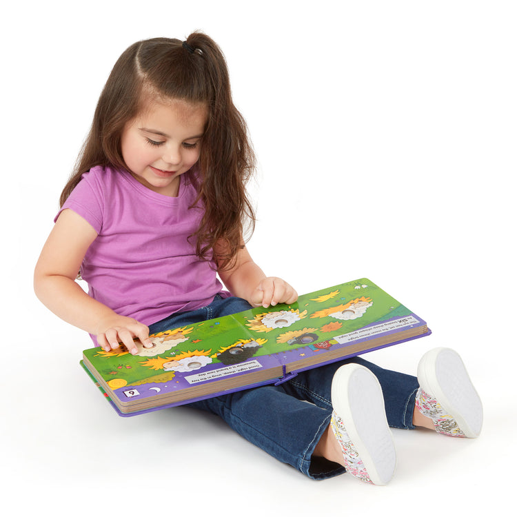 A child on white background with The Melissa & Doug Children's Book - Poke-a-Dot: Goodnight, Animals (Board Book with Buttons to Pop)