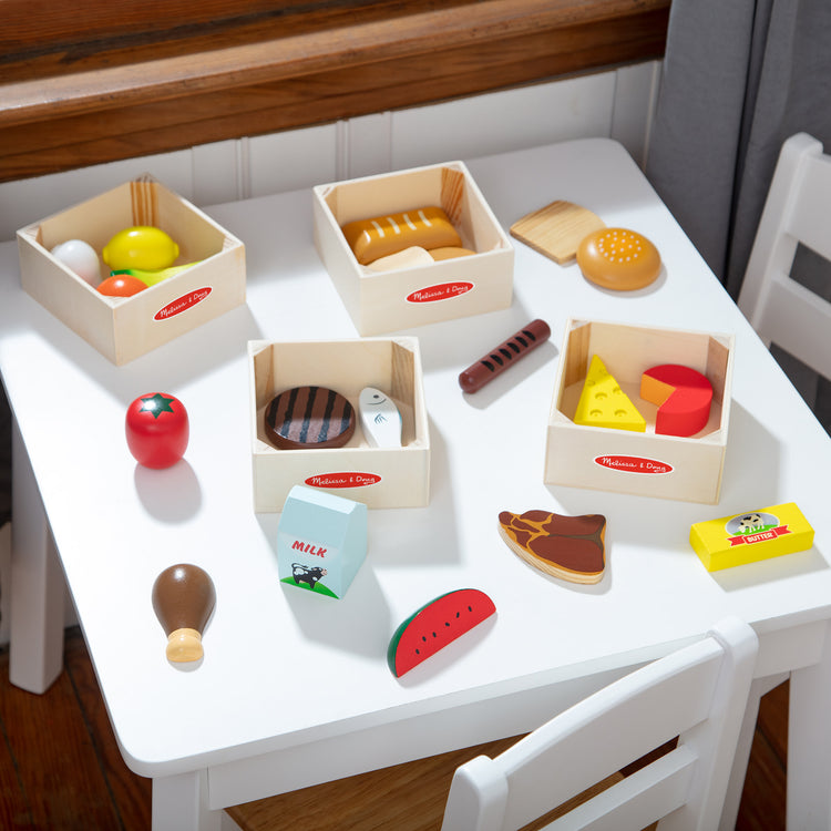 A playroom scene with The Melissa & Doug Food Groups - 21 Wooden Pieces and 4 Crates, Multi