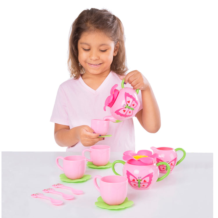 A child on white background with The Melissa & Doug Butterfly Tea Set (15 pcs) - Play Food Accessories