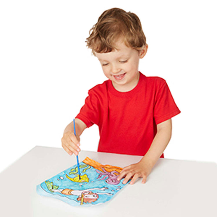 A child on white background with The Melissa & Doug My First Paint With Water Activity Books Set - Animals, Vehicles, and Pirates
