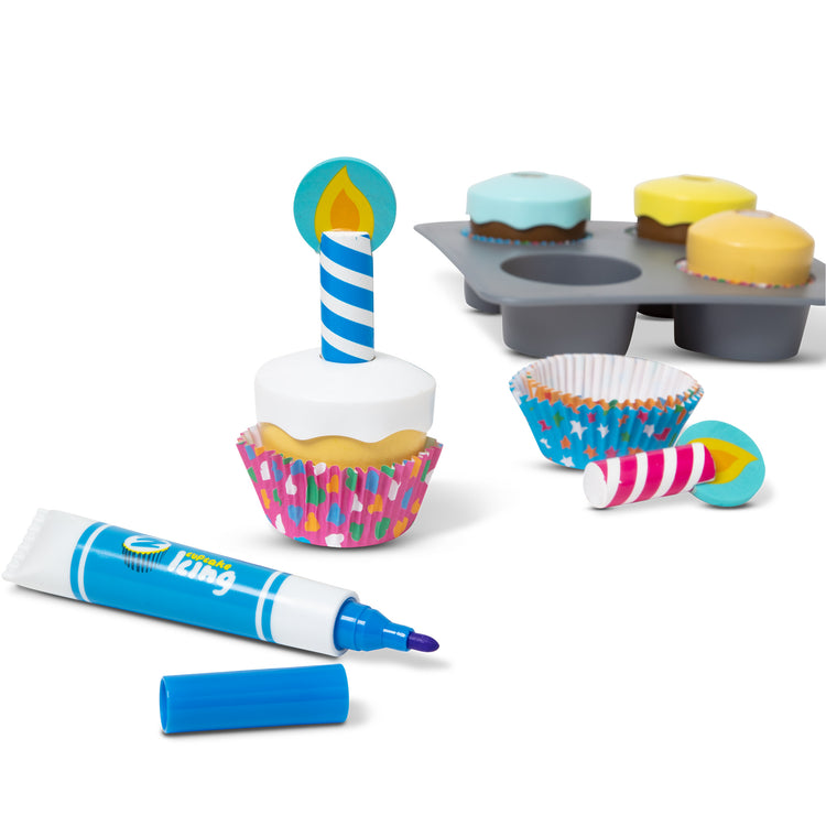 The loose pieces of The Melissa & Doug Bake and Decorate Wooden Cupcake Play Food Set