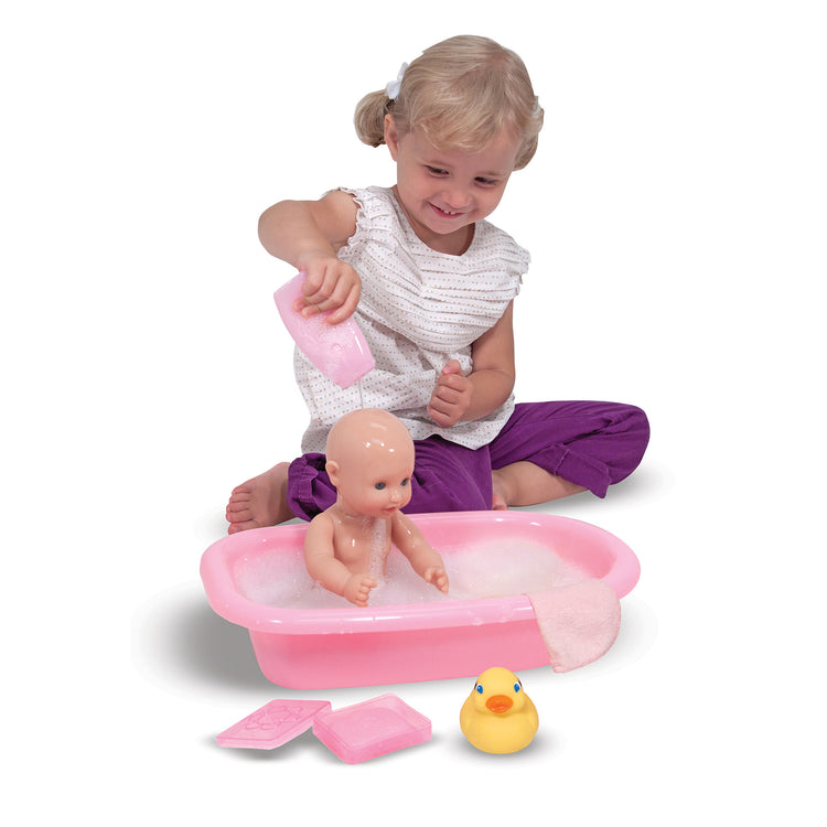 A child on white background with The Melissa & Doug Mine to Love Baby Doll Bathtub and Accessories Play Set (6 pcs)
