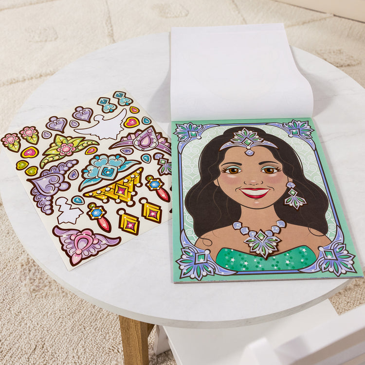 A playroom scene with The Melissa & Doug Make-a-Face Sticker Pad: Sparkling Princesses - 15 Faces, 4 Sticker Sheets