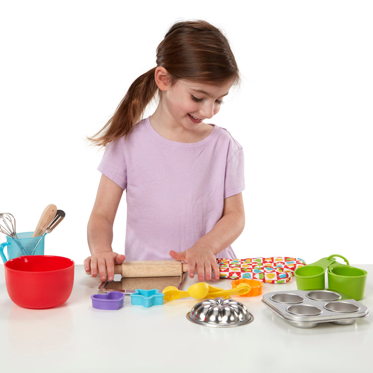 A child on white background with The Melissa & Doug Baking Play Set (20 pcs) - Play Kitchen Accessories