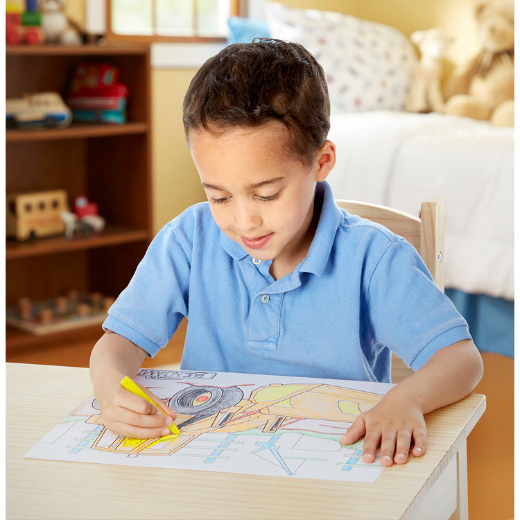 A kid playing with The Melissa & Doug Jumbo 50-Page Kids' Coloring Pad - Space, Sharks, Sports, and More