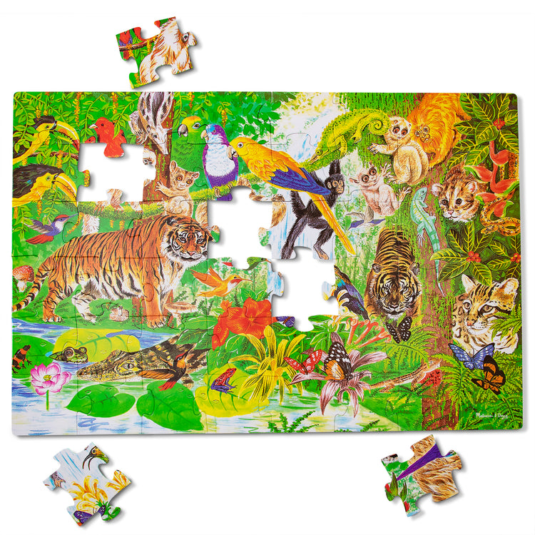 The loose pieces of The Melissa & Doug Rainforest Floor Puzzle (48 pcs, 2 x 3 feet)