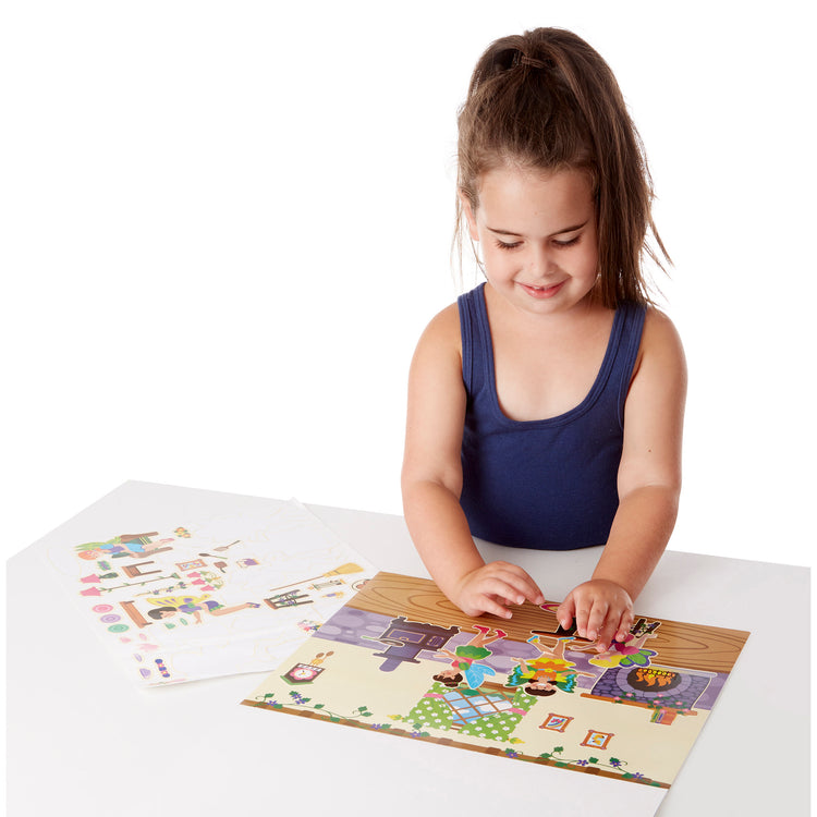 A child on white background with The Melissa & Doug Reusable Sticker Pad: Fairies - 200+ Stickers