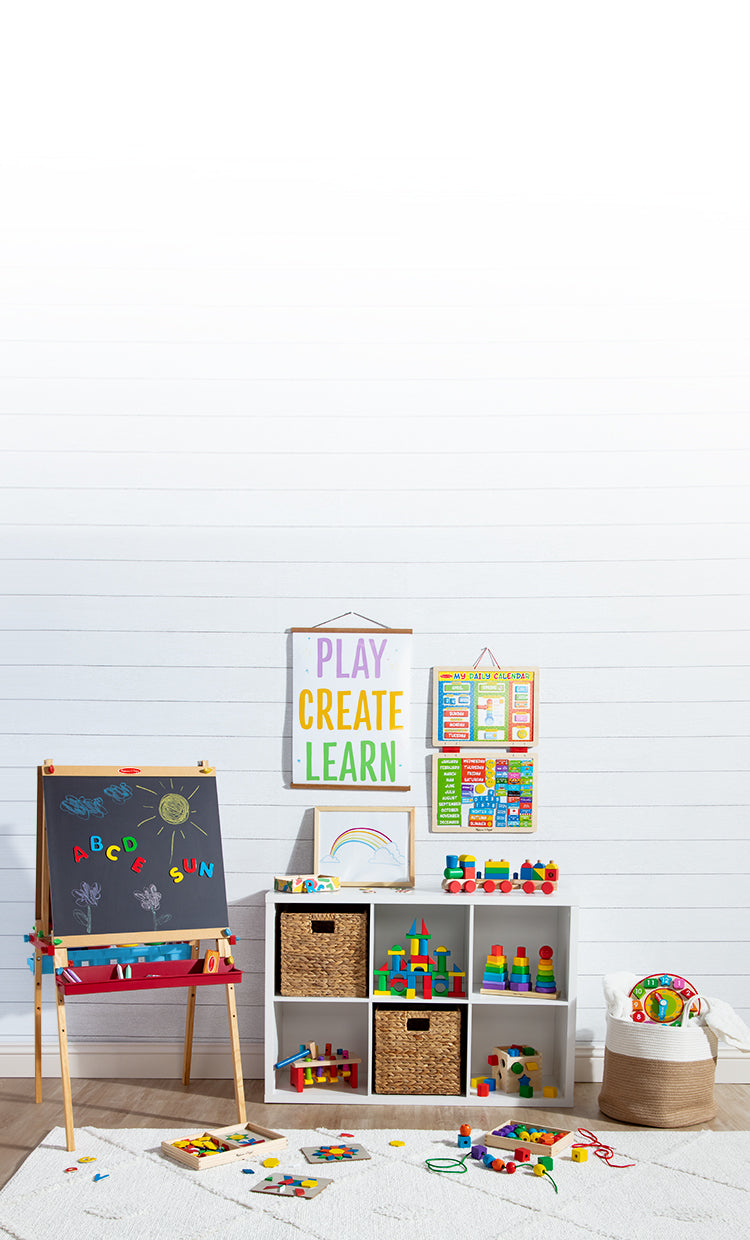 Playroom with deluxe standing easel, rainbow letter magnets, rainbow blocks, and rainbow stacker toy