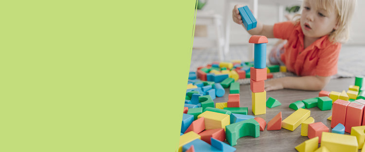 image of child playing with wooden blocks