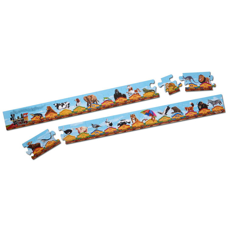 The loose pieces of The Melissa & Doug Alphabet Train Jumbo Jigsaw Floor Puzzle - Letters and Animals (28 pcs, 10 feet long)