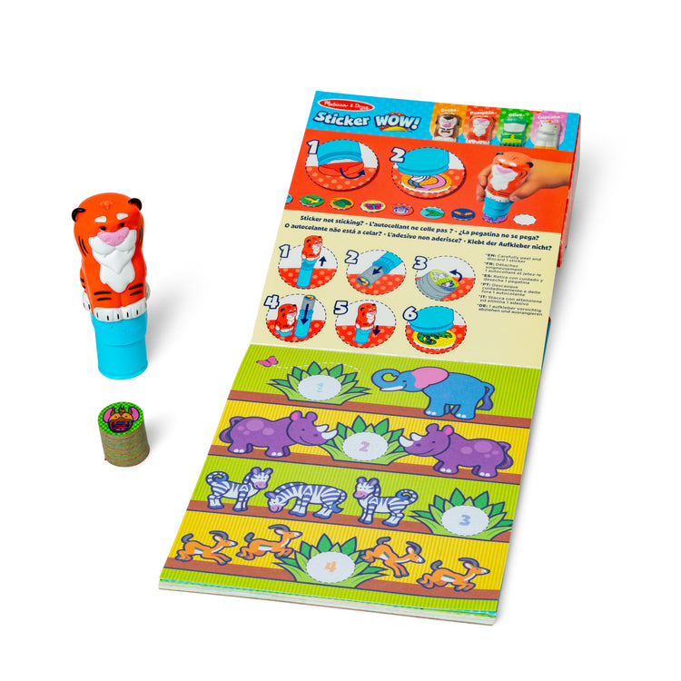 The loose pieces of The Melissa & Doug Sticker WOW!™ Tiger Bundle: Sticker Stamper, 24-Page Activity Pad, 600 Total Stickers, Arts and Crafts Fidget Toy Collectible Character