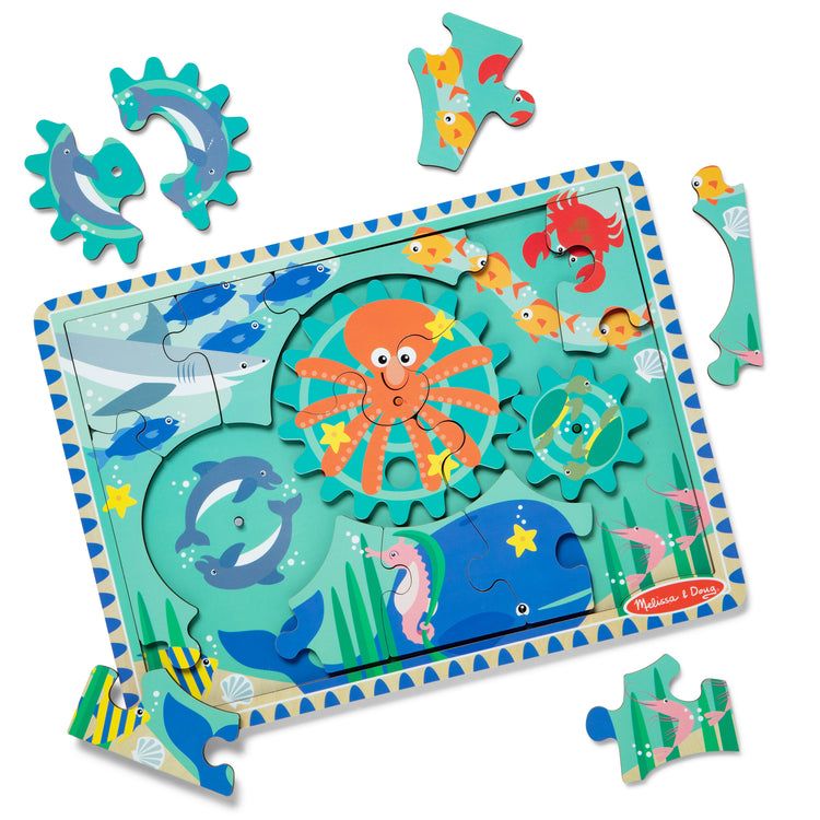 The loose pieces of The Melissa & Doug Wooden Underwater Jigsaw Spinning Gear Puzzle – 18 Pieces