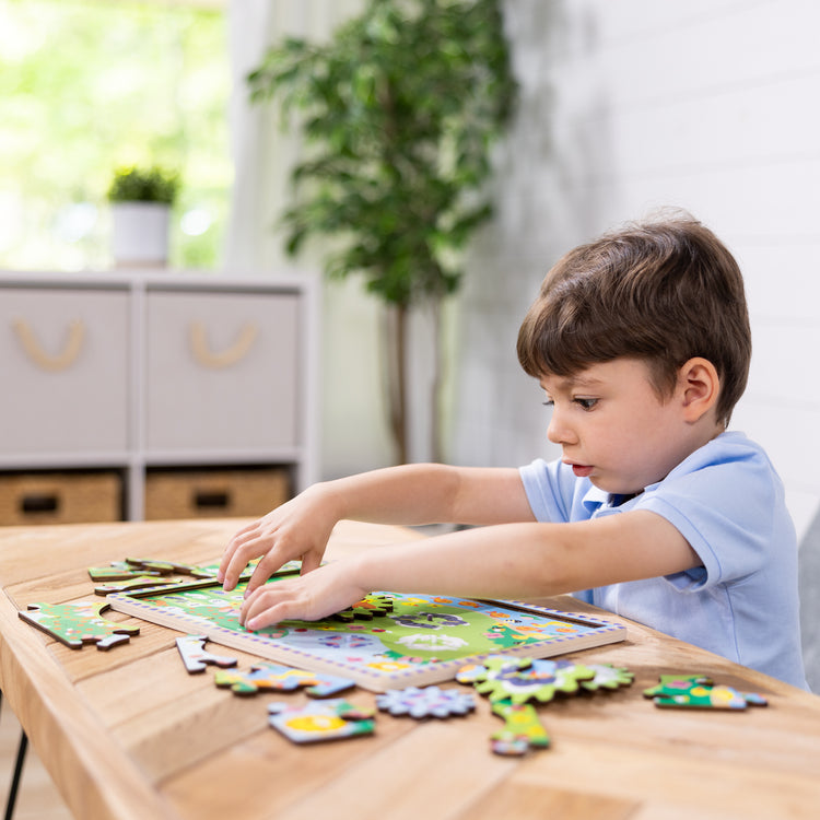 The pieces of the Wooden Animal Chase Gear Puzzle – 24 Pieces;A kid with the Wooden Animal Chase Gear Puzzle – 24 Pieces;The box for the Wooden Animal Chase Gear Puzzle – 24 Pieces; the Wooden Animal Chase Gear Puzzle – 24 Pieces;A kid with the Wooden Animal Chase Gear Puzzle – 24 Pieces;A photograph of a kid with the Wooden Animal Chase Gear Puzzle – 24 Pieces;a kid with the Wooden Animal Chase Gear Puzzle – 24 Pieces;a kid with the Wooden Animal Chase Gear Puzzle – 24 Pieces; the Wooden Animal Chase Gear 