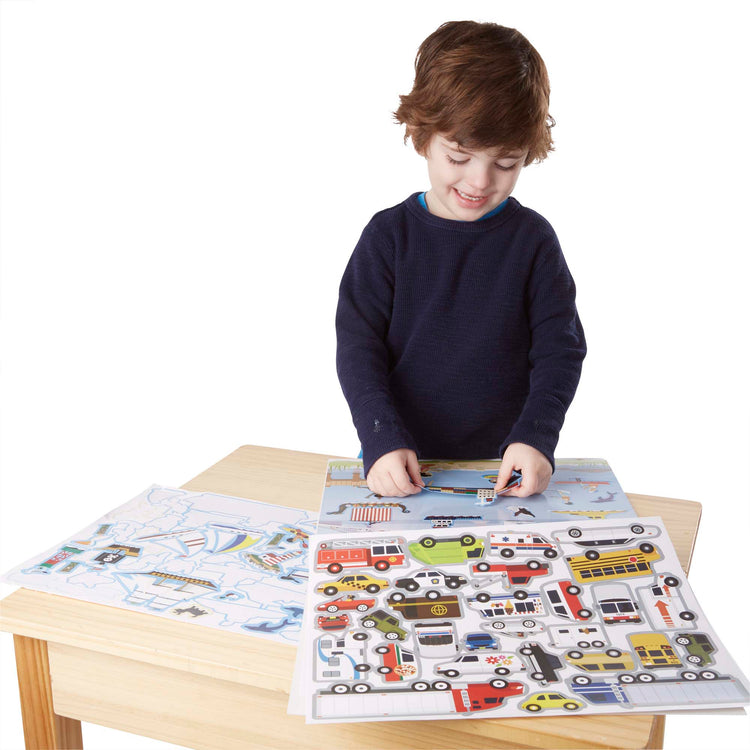 A child on white background with The Melissa & Doug Reusable Sticker Pad: Vehicles - 165+ Reusable Stickers