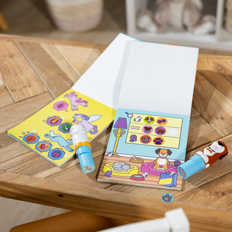 A playroom scene with The Melissa & Doug Sticker WOW!™ Dog and Unicorn Bundle: 2 24-Page Activity Pads, 2 Sticker Stampers, 600 Stickers, Arts and Crafts Fidget Toy Collectible Characters