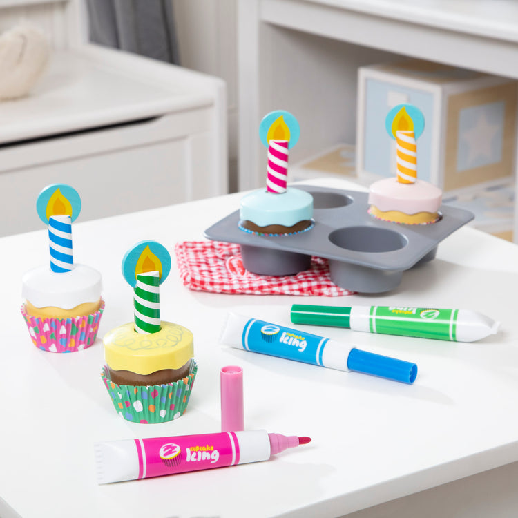 A playroom scene with The Melissa & Doug Bake and Decorate Wooden Cupcake Play Food Set