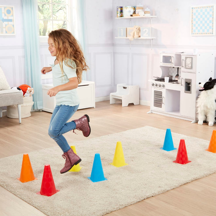 A kid playing with the Melissa & Doug 8 Activity Cones - Set of 8