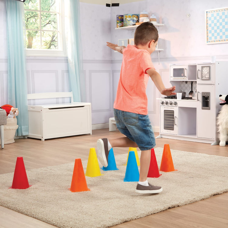 A kid playing with the Melissa & Doug 8 Activity Cones - Set of 8