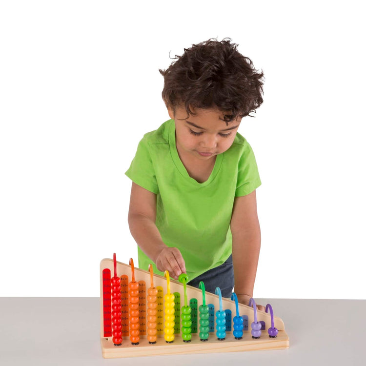 A child on white background with the Melissa & Doug Add & Subtract Abacus - Educational Toy With 55 Colorful Beads and Sturdy Wooden Construction