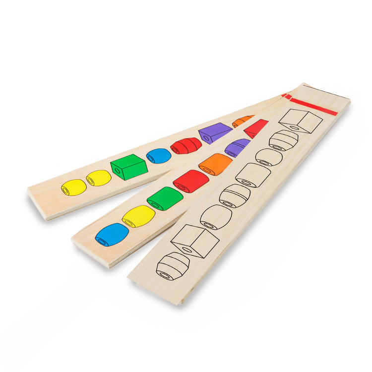 The loose pieces of the Melissa & Doug Bead Sequencing Set With 46 Wooden Beads and 5 Double-Sided Pattern Boards