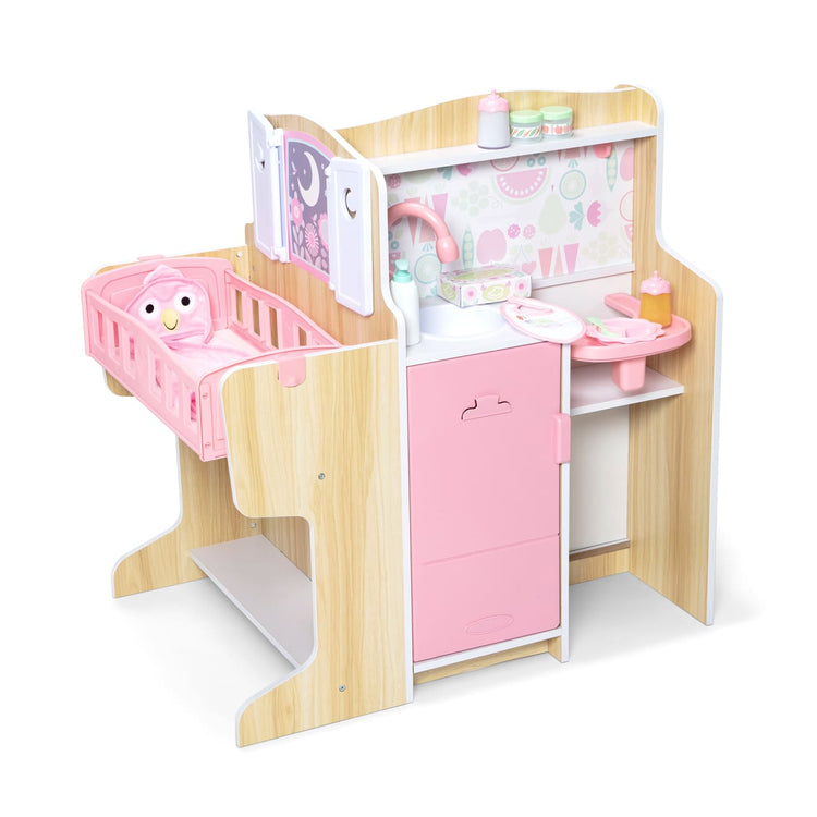 The loose pieces of the Melissa & Doug Baby Care Center and Accessory Sets