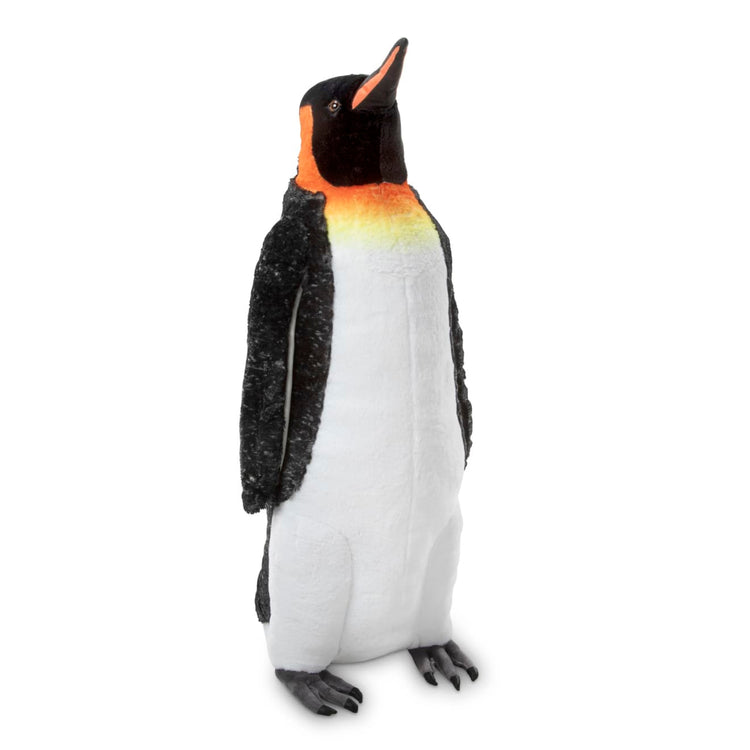 An assembled or decorated the Melissa & Doug Giant Lifelike Plush Emperor Penguin Standing Stuffed Animal (3.4 Feet Tall)