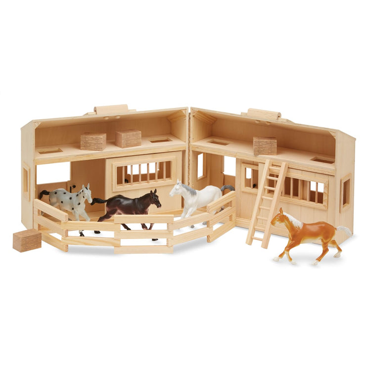 The loose pieces of the Melissa & Doug Fold and Go Wooden Horse Stable Dollhouse With Handle and Toy Horses (11 pcs)