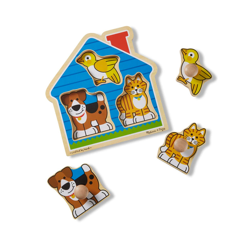 The loose pieces of the Melissa & Doug Pets Jumbo Knob Wooden Puzzle