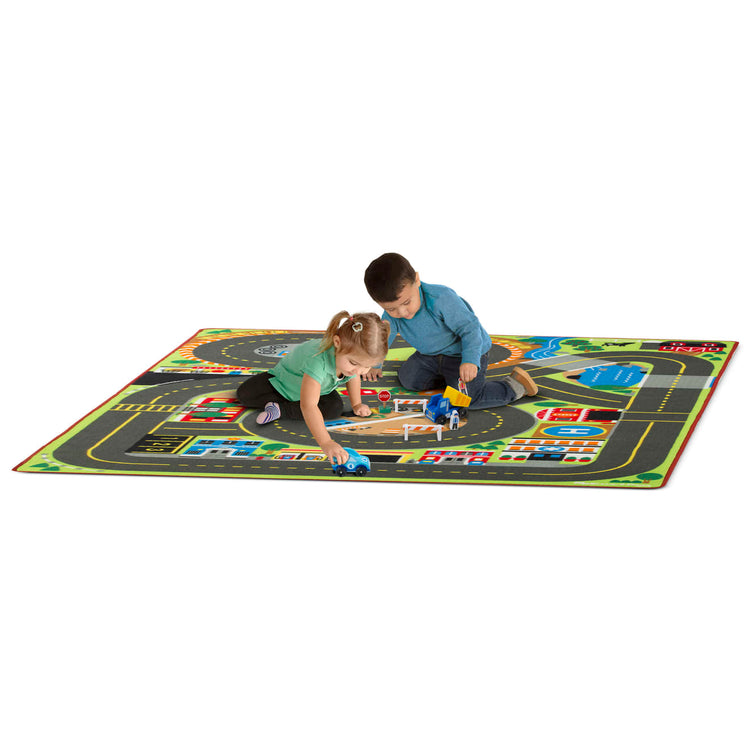 A child on white background with the Melissa & Doug Jumbo Roadway Activity Rug With 4 Wooden Traffic Signs (79 x 58 inches)