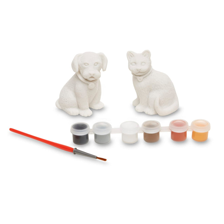 The loose pieces of the Melissa & Doug Created by Me! Pet Figurines Craft Kit (Resin Dog and Cat, 6 Paints, Paintbrush)