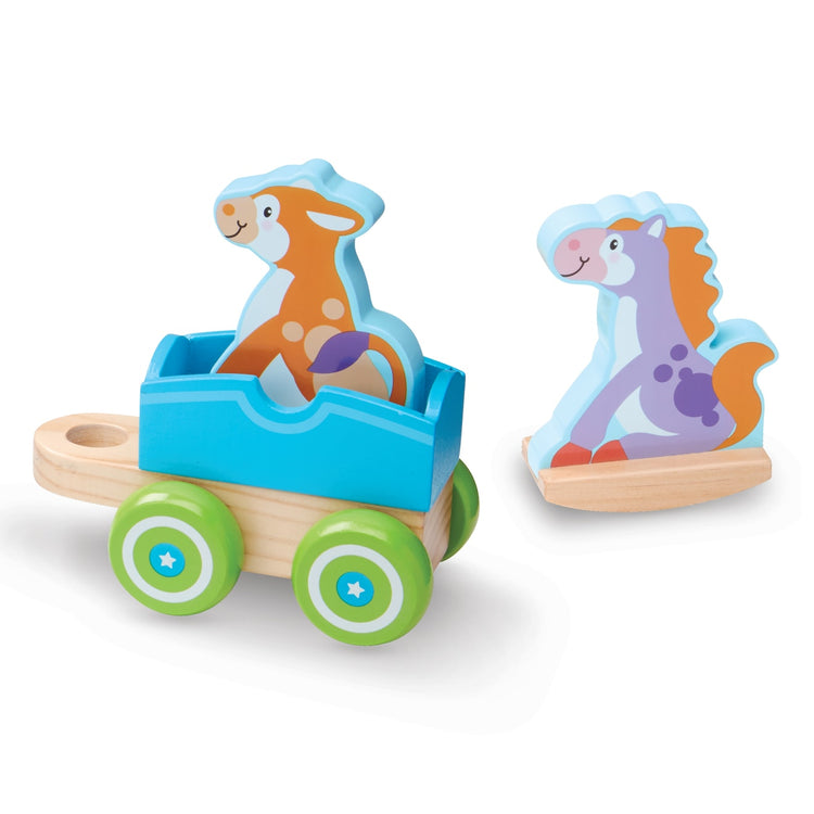 The loose pieces of the Melissa & Doug First Play Wooden Rocking Farm Animals Pull Train