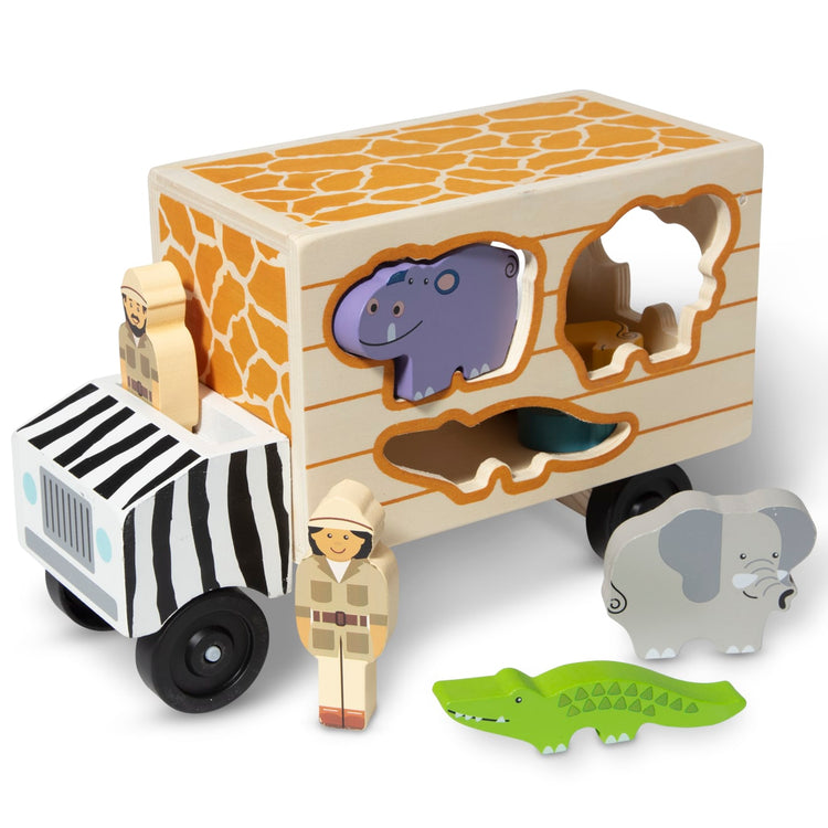 The loose pieces of the Melissa & Doug Animal Rescue Shape-Sorting Truck - Wooden Toy With 7 Animals and 2 Play Figures