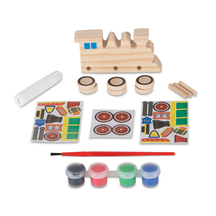 The loose pieces of the Melissa & Doug Train Wooden Craft Kit
