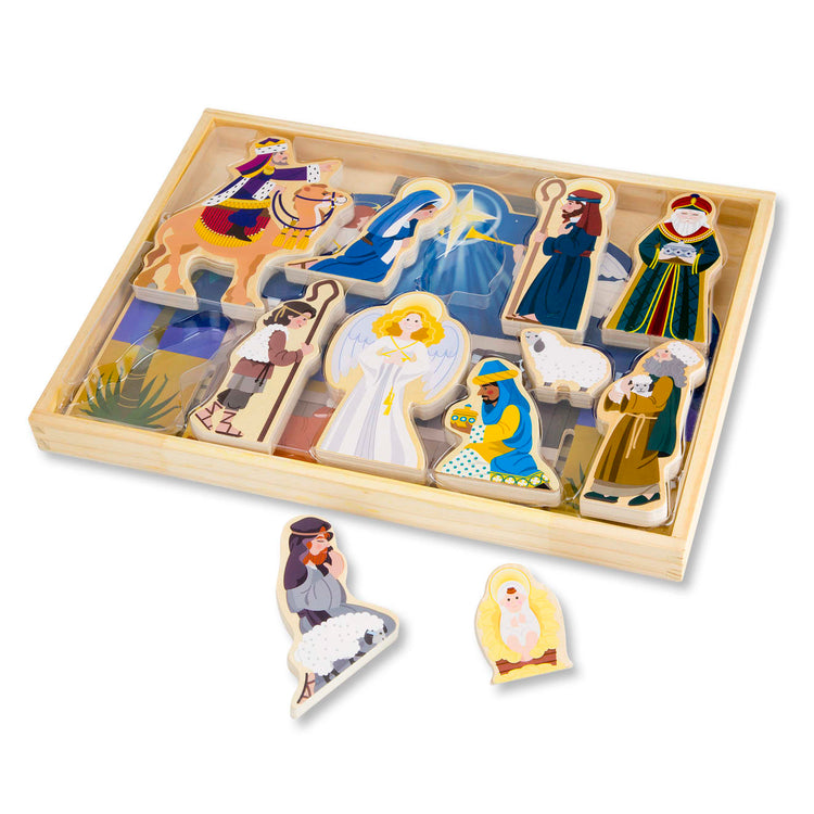 The loose pieces of the Melissa & Doug Classic Wooden Christmas Nativity Set With 4-Piece Stable and 11 Wooden Figures
