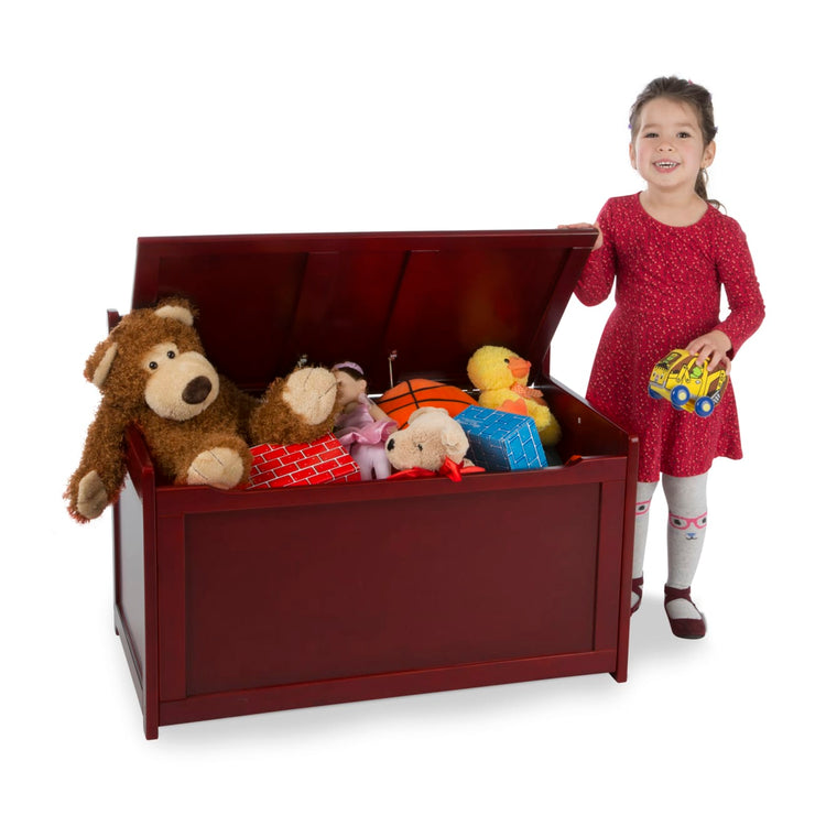 A child on white background with the Melissa & Doug Wooden Toy Chest (Espresso)