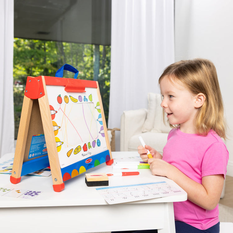 Melissa & Doug Toy Spotlight Take Along Activity Easel child playing