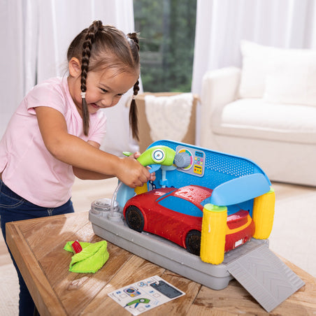 Melissa & Doug Toy Spotlight Spray & Shine Car Wash Play Set blog post child playing