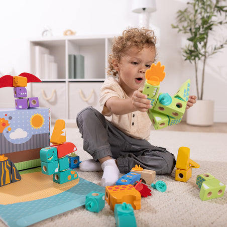 Melissa & Doug blog post 52 Fun & Easy Play Ideas for Screen-Free Week or Any Week child playing with Blockables Dinosaur