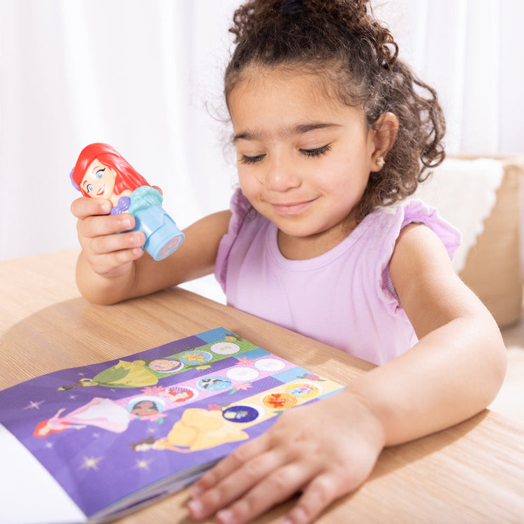 Melissa & Doug Traveling with Kids Take Sticker WOW! on Winter Break blog post child playing