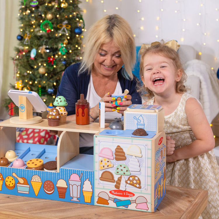 Melissa & Doug Food is Love Cooking Up Confidence with Pretend Play from Melissa & Doug blog post family playing at holidays