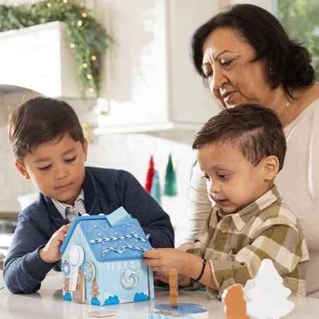 Melissa & Doug Toy Spotlight Blog Post Wooden Gingerbread House Play Set Family Playing