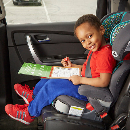 Melissa & Doug Our Top Toys for Summer Travel Fun blog post toddler in car seat with Water WOW! toy